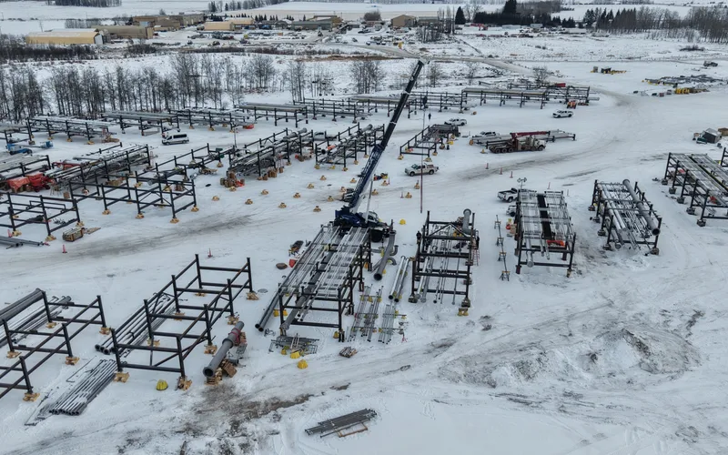 Aerial drone view of Bunch Clearwater mod yard showing pipe rack modules and structural steel in winter